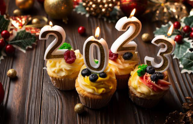 New year 2023 cupcakes with number candles.